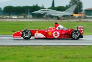 Michael Schumacher Of Ferrari Races Eurofighter Typhoon Aircraft