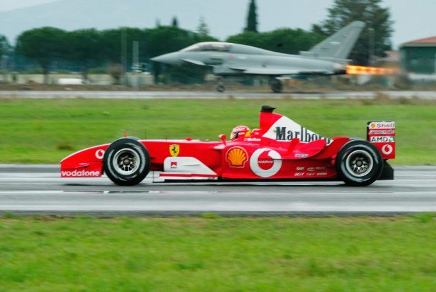 Michael Schumacher Of Ferrari Races Eurofighter Typhoon Aircraft