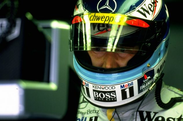 Mika Hakkinen of Finland and McLaren-Mercedes watches the tv screens during practic